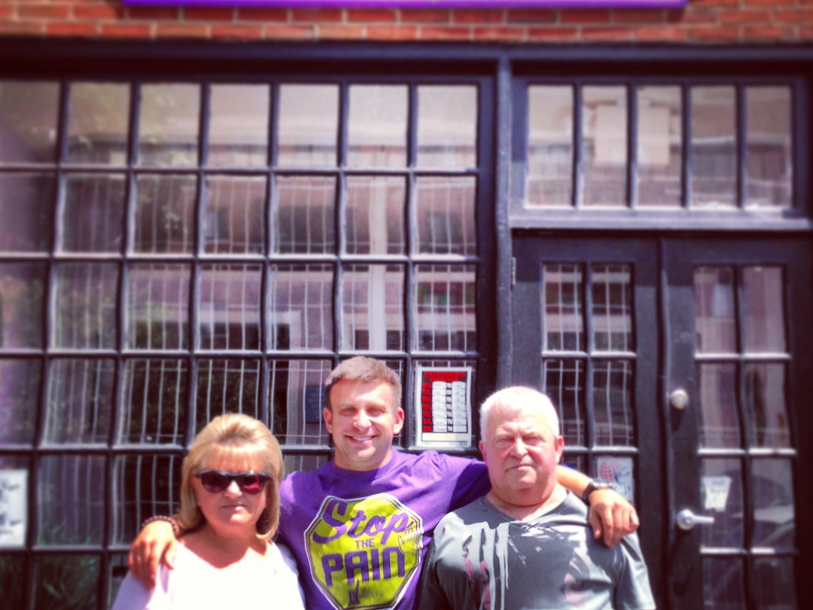 Jack with his parents in front of the original Art of Medicine storefront