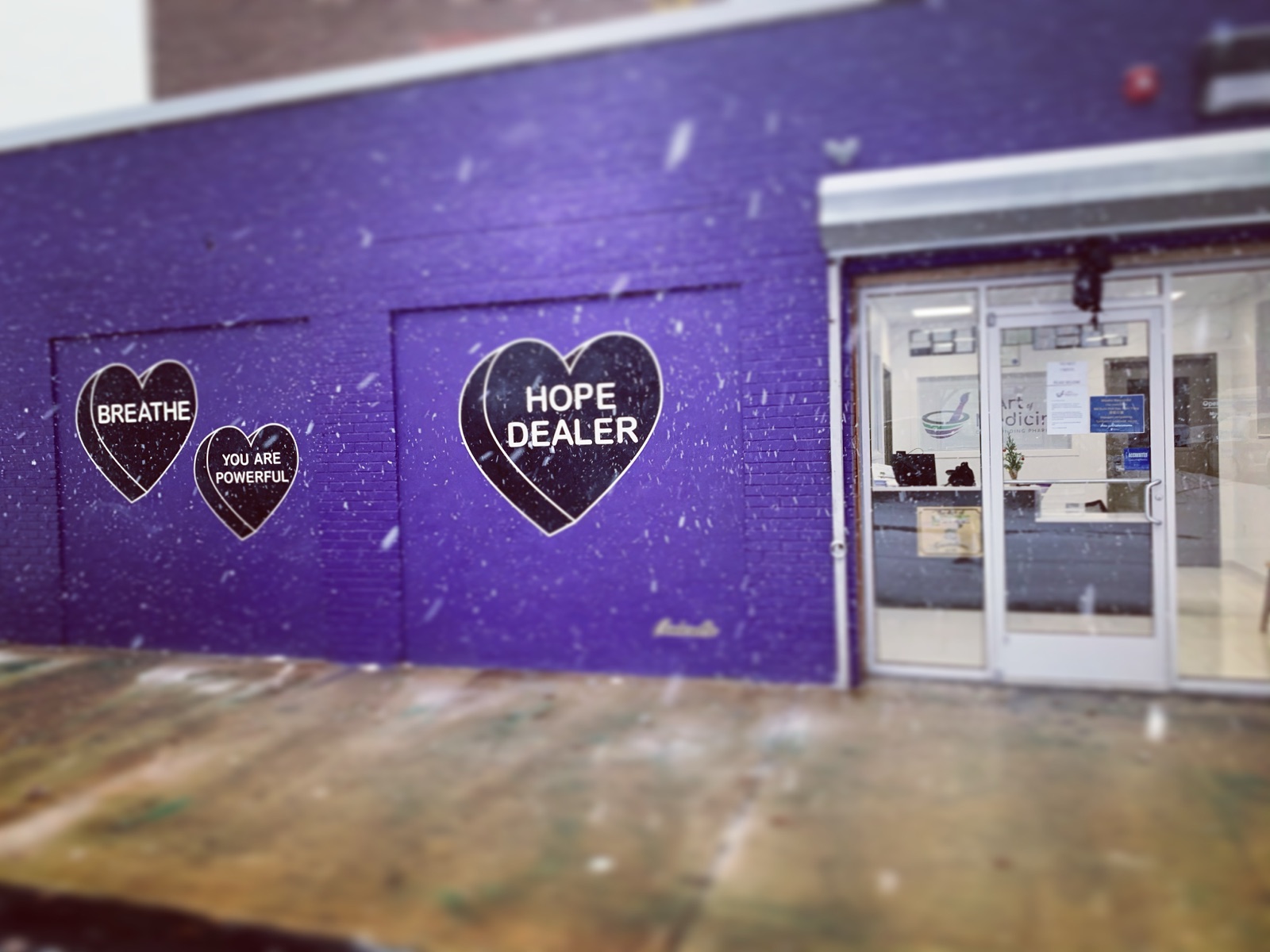 The purple Art of Medicine building with its painted hearts